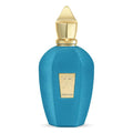A blue textured perfume bottle with a gold cap and a gold label on the front, set against a plain white background.
