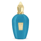 A blue textured perfume bottle with a gold cap and a gold label on the front, set against a plain white background.