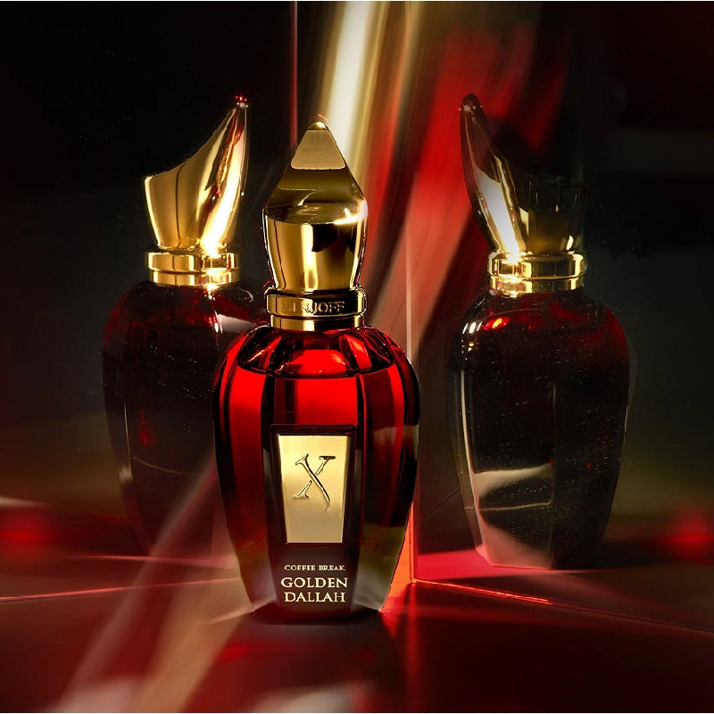 Three red and gold perfume bottles with 'Golden Dallah' branding on a dark background.