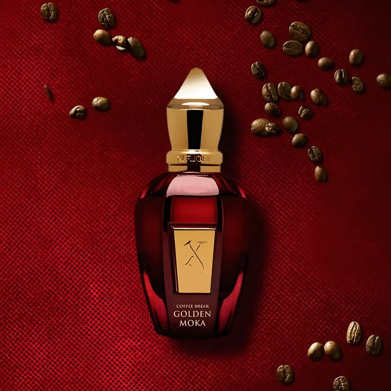 Perfume bottle labeled 'Golden Moka' on a red textured background with coffee beans.
