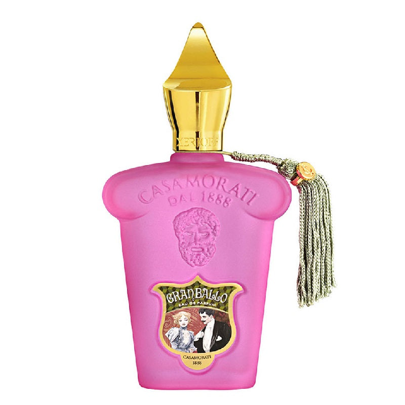 A pink bottle of Casamorati Gran Ballo Eau de Parfum with a gold cap and a tassel.