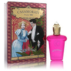 The product image shows a pink perfume bottle with a gold cap, alongside a box with an illustration of a man and a woman from the early 20th century.