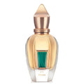 Gold and clear perfume bottle with green accent on a white background