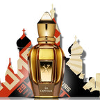 Gold perfume bottle with 'La Capitale' text against a colorful architectural background