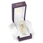 Perfume bottle with gold cap in a Xerjoff branded box on a white background