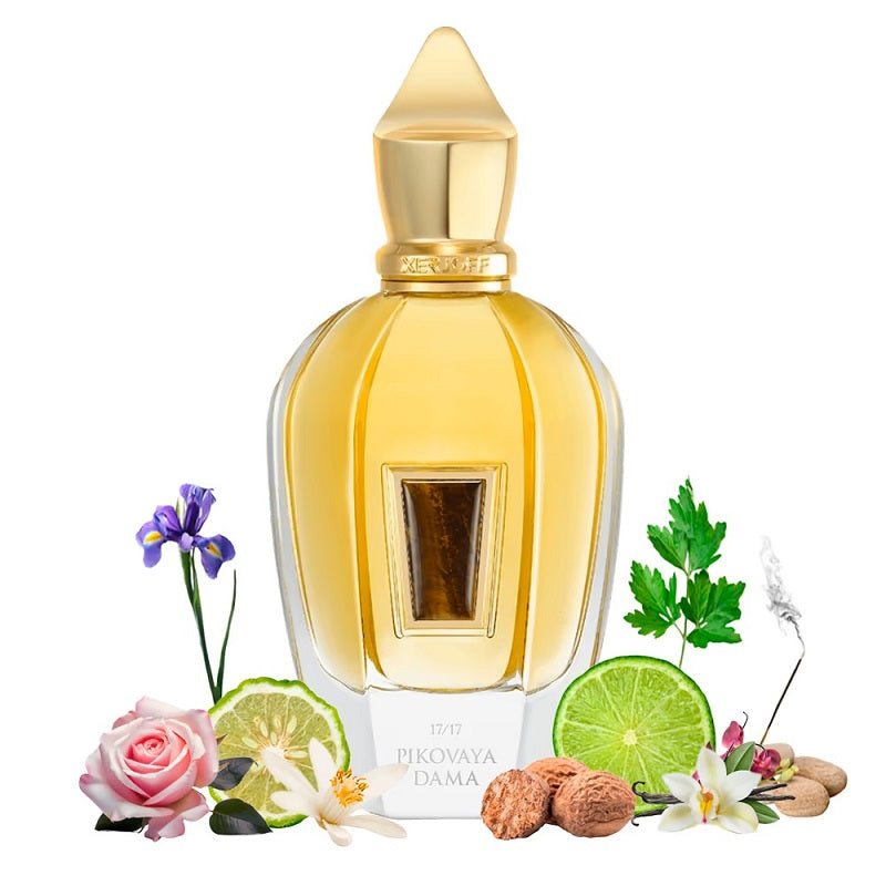 Perfume bottle with floral and fruit elements on a white background