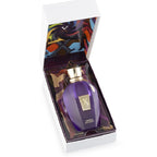 Purple perfume bottle with gold cap in a decorative box on a white background