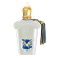 A white perfume bottle with a blue label featuring a vintage design, topped with a golden cap and a blue tassel.