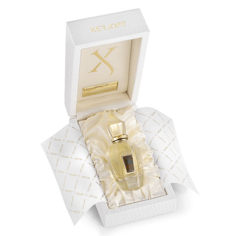 Gold perfume bottle in a decorative box with 'X' branding on a white background