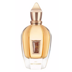 Perfume bottle with gold cap and clear body on a white background