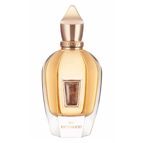 Perfume bottle with gold cap and clear body on a white background