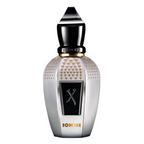 A luxury perfume bottle with a metallic silver body, gold heart-patterned accents, a black central label with a stylized 'X', and a glossy black cap, shown on a plain white background.