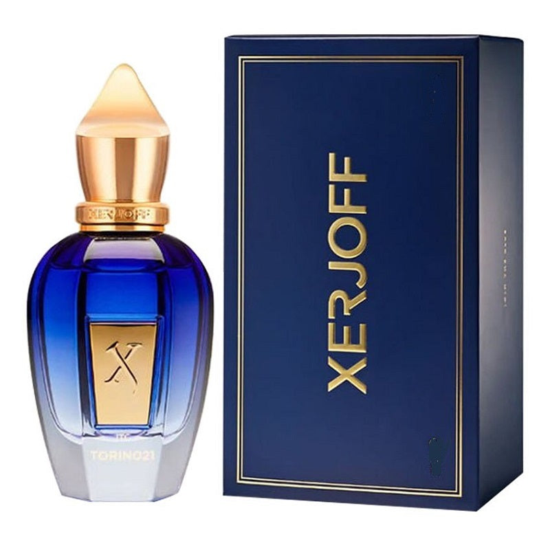 Blue perfume bottle with gold accents and Xerjoff packaging on a white background