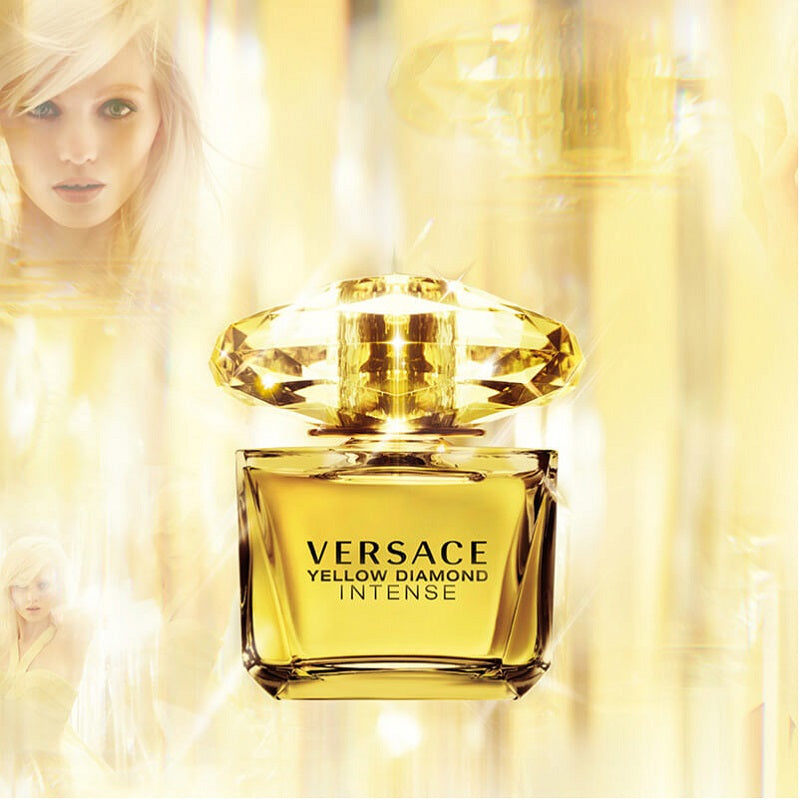 Versace Yellow Diamond Intense perfume bottle with a blurred woman in the background