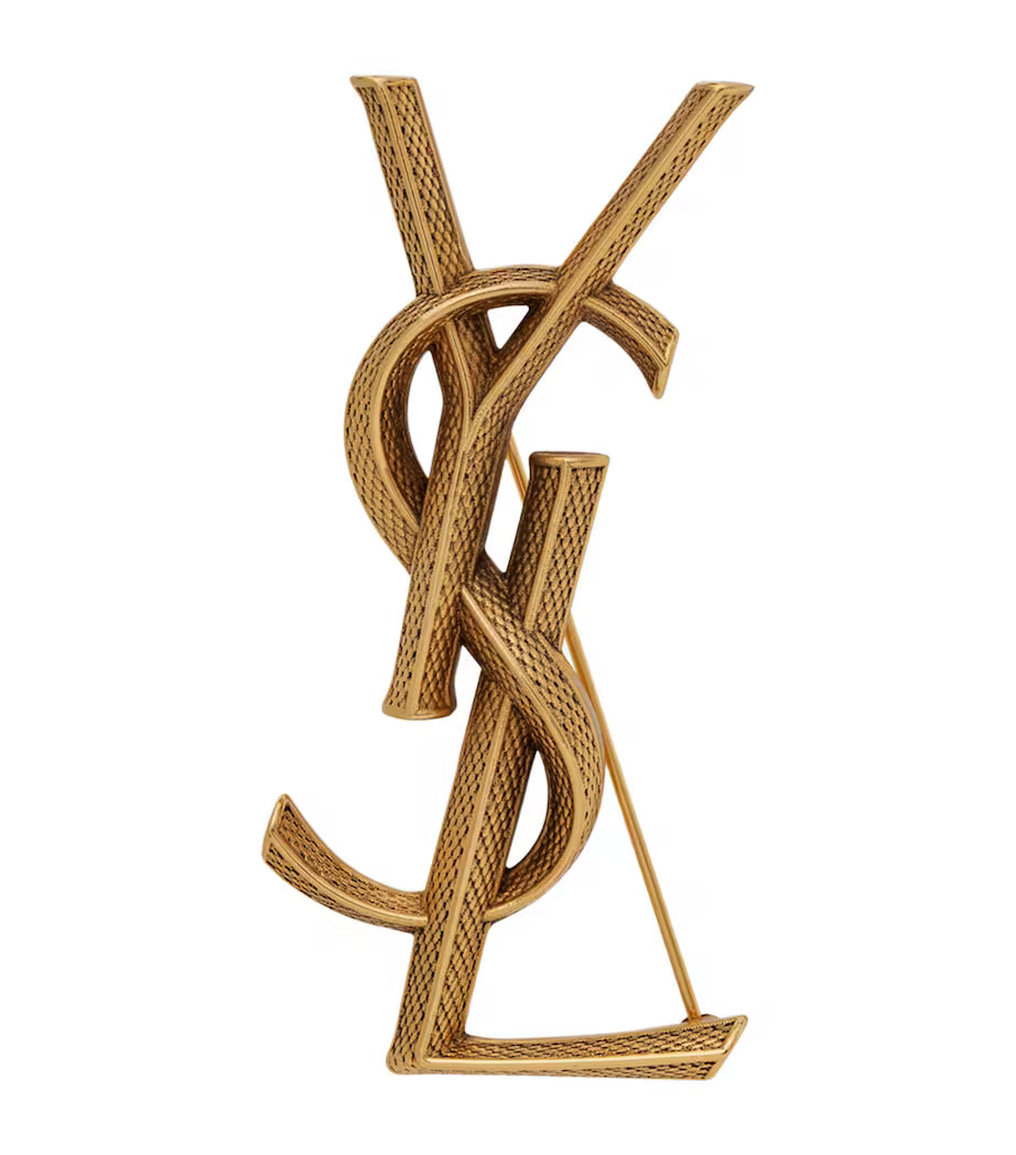 Gold Yves Saint Laurent logo on a white background