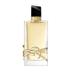 A glass bottle of Libre Eau de Parfum by Yves Saint Laurent with a gold cap and a decorative gold band around the mid-section.