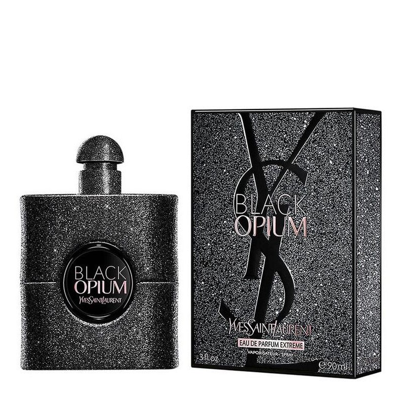 Yves Saint Laurent Black Opium Eau de Parfum bottle and its retail box, both in a dark glittery black finish with the brand's interlocking YSL logo.