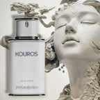 Yves Saint Laurent Kouros perfume bottle with classical sculpture in the background