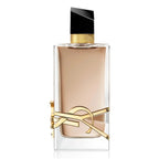 Perfume bottle with gold accents on a white background