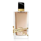 Perfume bottle with gold accents on a white background