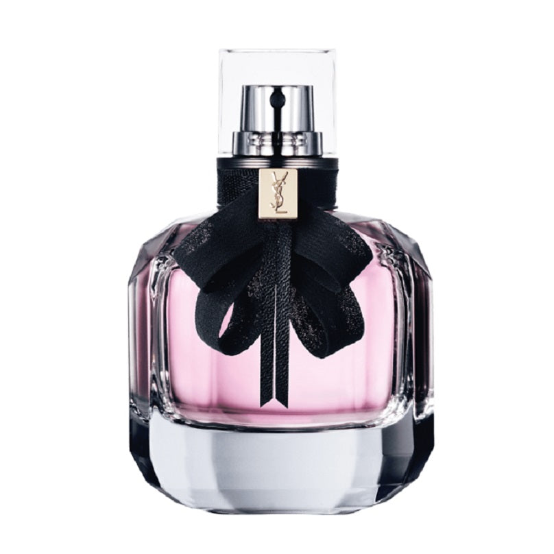 Perfume bottle with black ribbon and Yves Saint Laurent logo on a white background