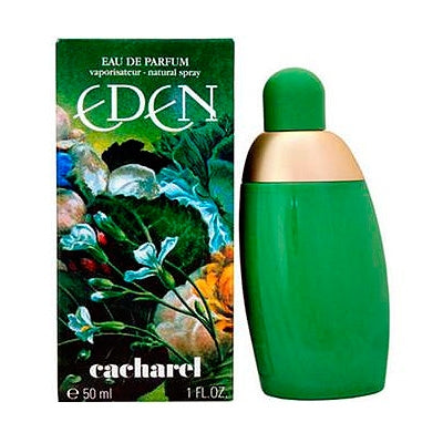 A green bottle of Eden Eau de Parfum by Cacharel, with a gold cap and a colorful floral box in the background.