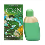A product image featuring a green bottle of 'Eden' Eau de Parfum by Cacharel, with a floral design on the packaging. The bottle is accompanied by its box, both displaying vibrant colors and floral graphics.