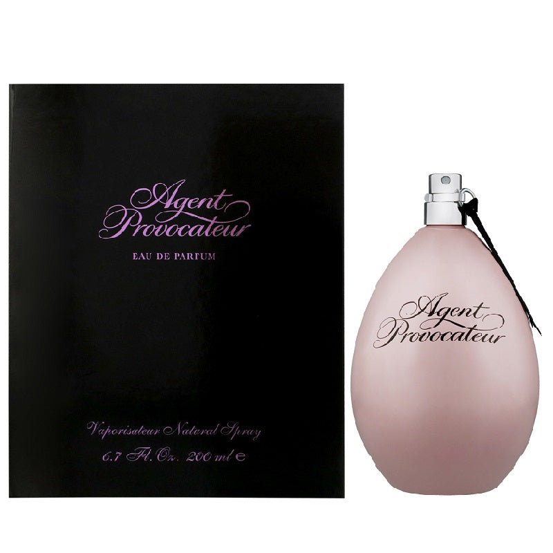 Lifestyle image of Agent Provocateur Package and bottle on a white background