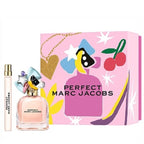 A gift set of Marc Jacobs Perfect Eau de Parfum, displaying the bottle, a mini perfume bottle, and packaging with pink and multicolor design.