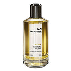 A glass bottle of Mancera Cedrat Boise Intense Eau de Parfum with a black cap and a yellow-tinted perfume visible inside.