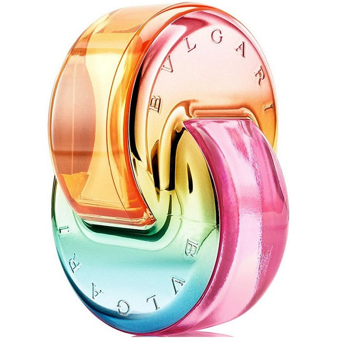 A colorful bottle of Omnia Mary Katrantzou Eau de Parfum by Bvlgari with a spiral design transitioning from pink to orange to turquoise.
