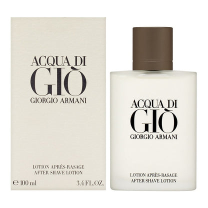 The image shows a product packaging for Acqua Di Gio After Shave Splash by Giorgio Armani, featuring a white box and a clear bottle with the after shave lotion inside. The packaging text is in black and brown, indicating the brand and product name.