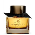 A bottle of My Burberry Black eau de parfum with a clear glass design and a black cap, adorned with a black bow.