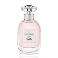 A bottle of Coach Dreams 40ml Eau de Parfum with a pink hue and a decorative cap.