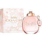 A Coach Floral Eau de Parfum bottle with a pink label and packaging, featuring a floral design.