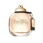 A glass bottle of Coach the Fragrance with a gold cap and a floral design, including an illustration of a horse and carriage.
