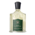 A bottle of Creed Bois du Portugal eau de parfum with a green label, white liquid, and a black cap.