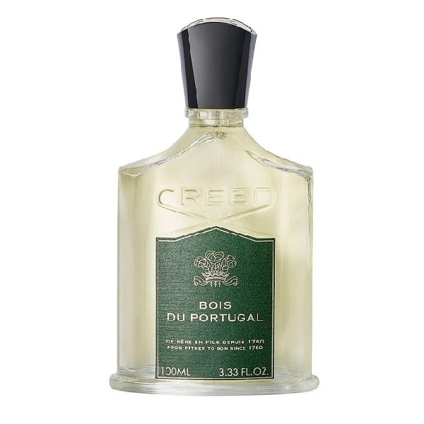 A bottle of Creed Bois du Portugal eau de parfum with a green label, white liquid, and a black cap.