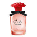 A bottle of Dolce Rose eau de toilette by Dolce Gabbana, featuring a clear glass container with a red rose cap and a black bow.