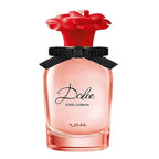 A bottle of Dolce Rose eau de toilette by Dolce Gabbana, featuring a clear glass container with a red rose cap and a black bow.