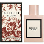 Gucci Bloom eau de parfum bottle and packaging with floral print design.