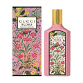 Gucci Flora Gorgeous Gardenia perfume bottle and packaging with a floral design.