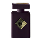 A black bottle of Side Effect Eau de Parfum by Initio, featuring a gold label with intricate designs.