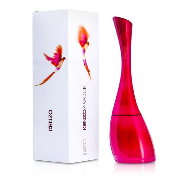 A product image featuring the Kenzo Amour (100ml) Eau de Parfum bottle and packaging. The bottle is red with a slim design, and the packaging is white with a multicolored floral graphic.