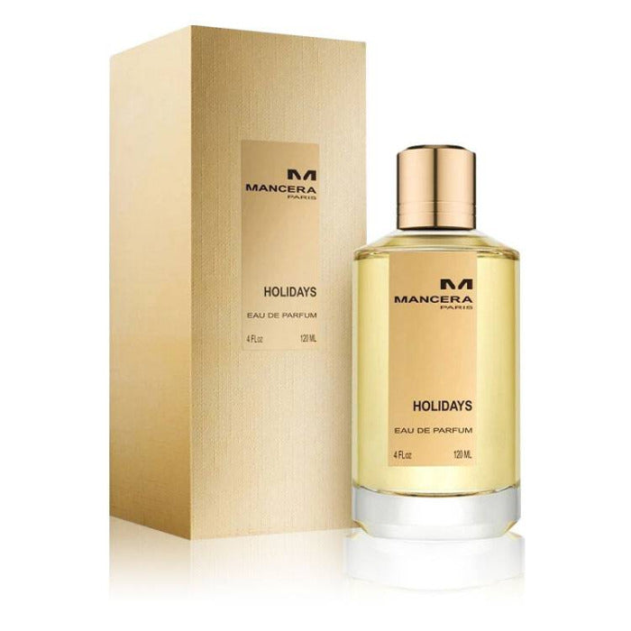 A 120ml bottle of Mancera Holidays Eau de Parfum, with a gold-colored box. The bottle is transparent, showcasing the golden-colored perfume liquid, with a gold-colored cap.