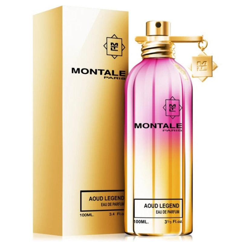 A bottle of Montale Aoud Legend Eau de Parfum with its packaging. The bottle is transparent with a pink hue and the packaging is gold with black text.