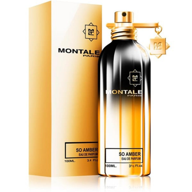 A bottle of Montale So Amber Eau de Parfum with a gold and black label, placed in front of its packaging box which has matching design elements.