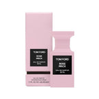 A pink bottle of Tom Ford Rose Prick Eau de Parfum with its matching pink box, both featuring a clear label.