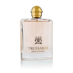 A glass bottle of Trussard Delicate Rose Eau de Toilette with a gold-colored cap.