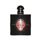 A black bottle of Black Opium Eau de Parfum by Yves Saint Laurent with a sparkling label and a gold cap.